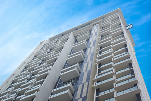 Condo view from the ground outside on a sunny day.